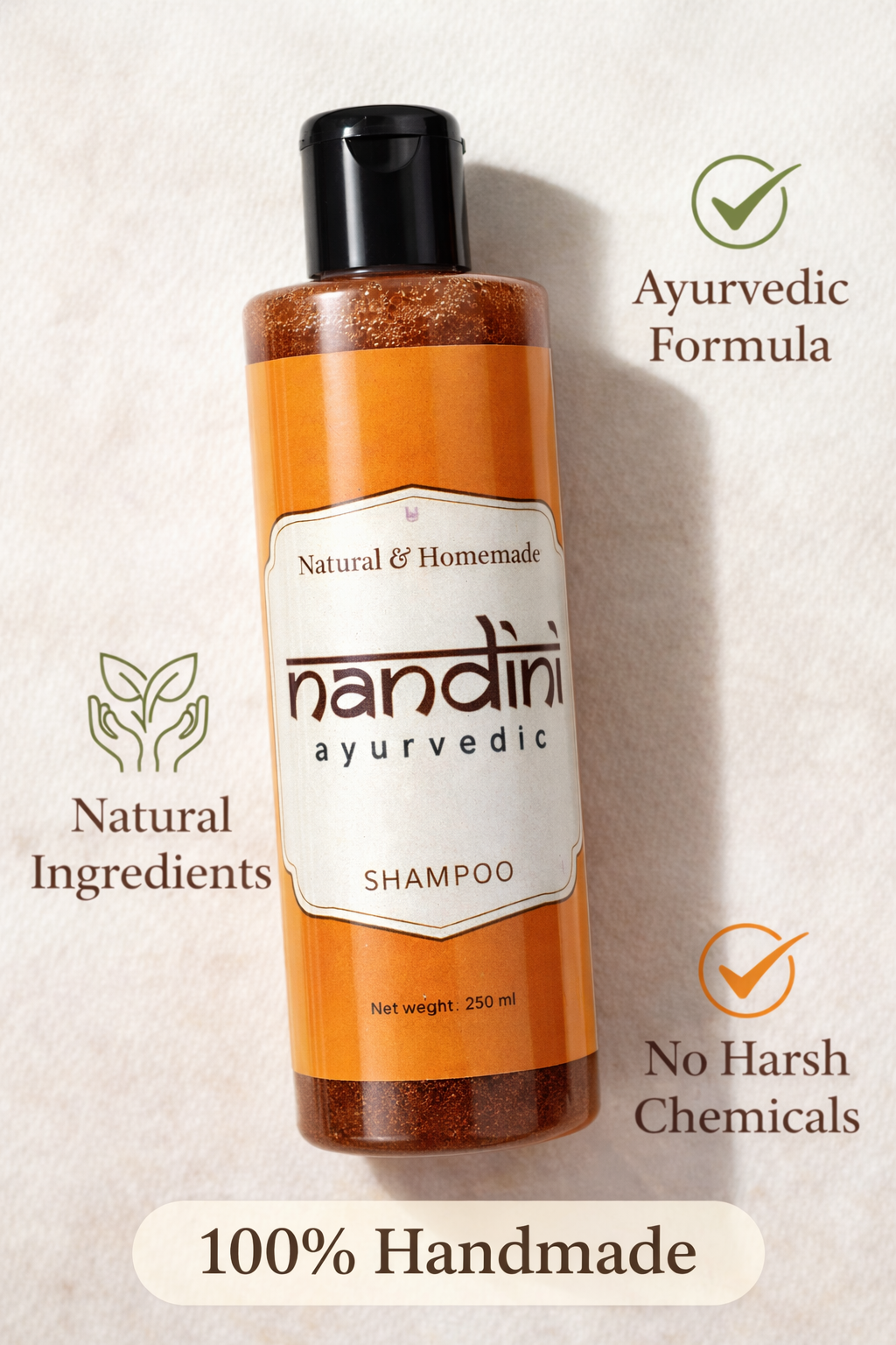 A 250 ml bottle of Nandini Ayurvedic Shampoo with an orange label and black cap, set against a textured beige background with promotional text overlays highlighting its natural ingredients, ayurvedic formula, and handmade quality.