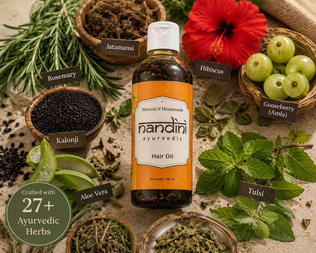 A bottle of Nandini Ayurvedic Hair Oil centered on a styled flat-lay background with labeled ingredients including rosemary, jatamansi, hibiscus, gooseberry, kalonji, aloe vera, tulsi, and mint leaves.